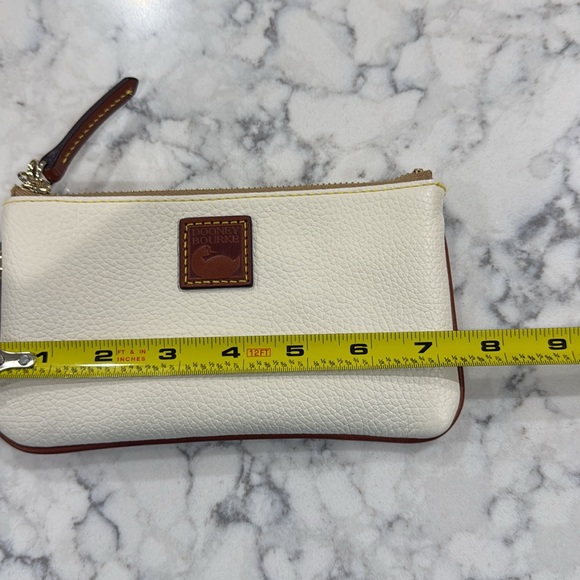 ￼New without tag Dooney and Bourke large wristlet wallet. Creamy white. - Picture 7 of 9